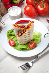 Burritos filled wiht minced meat, bean and vegetables.