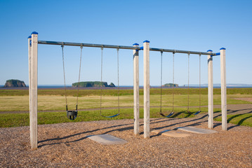 Swing set on a sunny day.