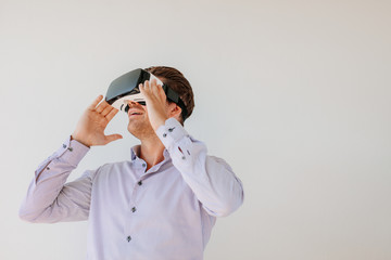 Caucasian male model wearing VR goggles