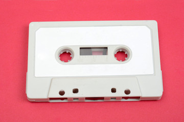Obraz premium Retro Vintage Audio Cassette on Pink Background