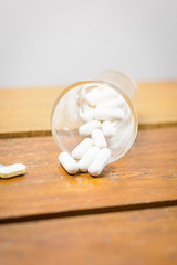 Fototapeta na wymiar pills medicine on wood table