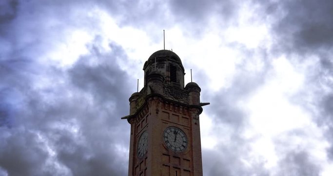 Time-lapse of clock tower with moody atmospheric clouds