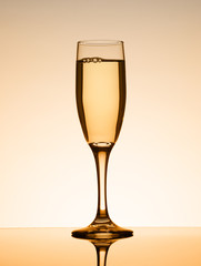 Champagne glass on smooth surface.