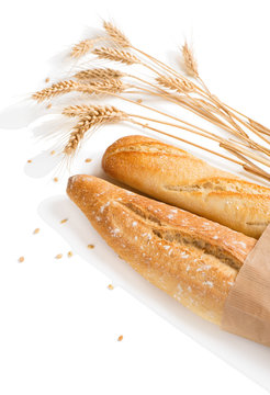 Two baguettes bread with wheat ears.