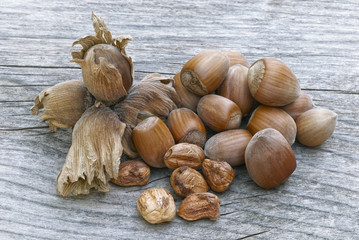 Hazelnuts on wooden table, fruit of hazel (Corylus avellana)