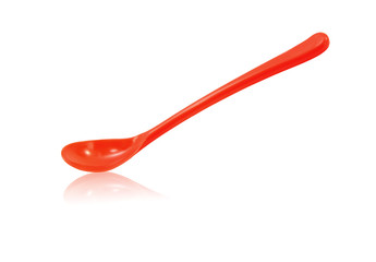Red plastic spoon isolated on white background