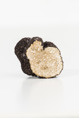 Truffle with plane and glass, white background