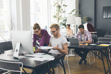 Young business people working at office on new project