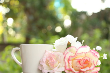 Coffee cup and flowers.