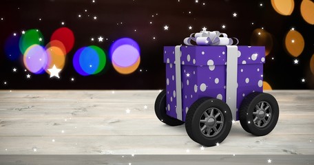 Composite image of purple wrapped with polka dot gift box on whe