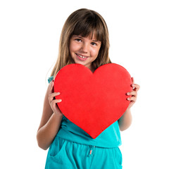 Young girl holding a heart