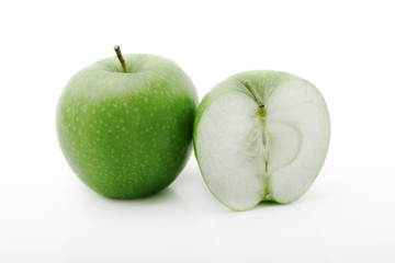 Juicy green apples on the white background