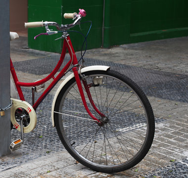 City design: red basket in the form of antic bicycle