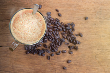 Cup of Espresso coffee and coffee beans background
