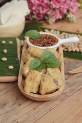 Fried tofu, chinese vegetarian food with sauce.