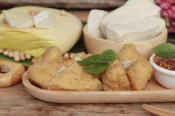 Fried tofu, chinese vegetarian food with sauce.
