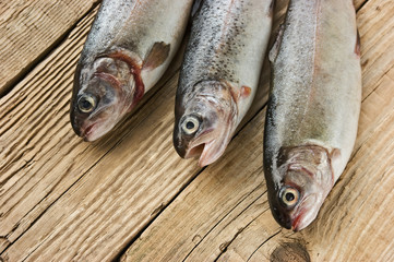 rainbow trout on a wooden board