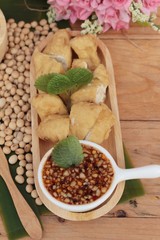Fried tofu, chinese vegetarian food with sauce.