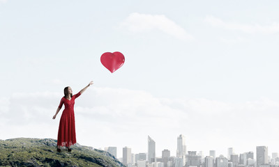 Obraz na płótnie Canvas Woman in passionate red dress . Mixed media