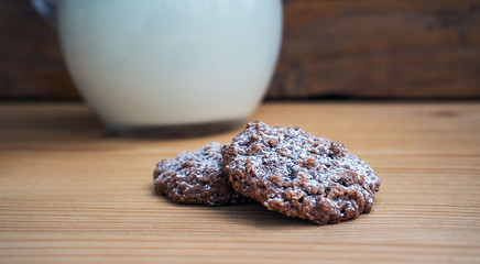 Chocolate cookies with milk jug. Morning mood. Selective focuse