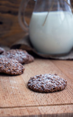 milk with chocolate biscuits cereals. Selective focus. Vertical