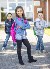 students outside school standing together