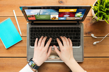 Fototapeta premium close up of woman or student typing on laptop