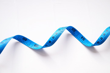 Tape measuring on white background
