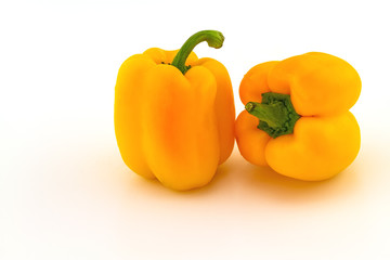 Colorful of fresh yellow sweet bell pepper (capsicum)   stack on white background
