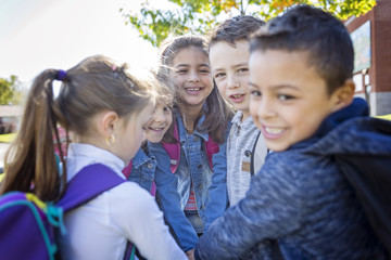 students outside school standing together