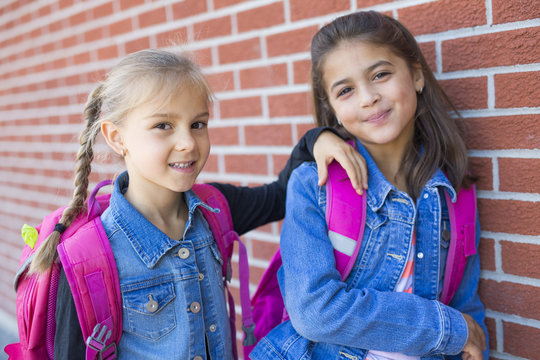 two childs girls elementary school outside