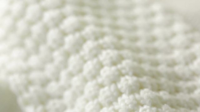 white knitted wool texture. use as background. close-up