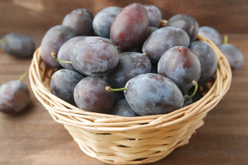 Fresh raw prunes in a basket