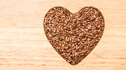 Raw flax seeds linseed heart shaped