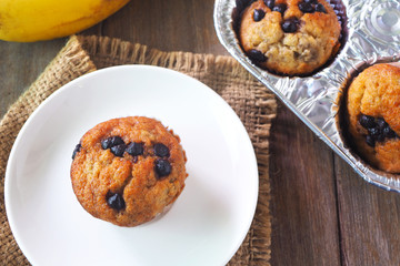 Top view of homemade banana muffins on a wooden table.