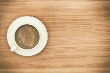 Hot coffee on wooden table.