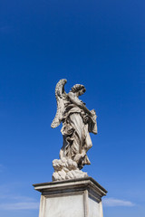 Fototapeta na wymiar Sculpture on Sant Angelo Bridge in Rome