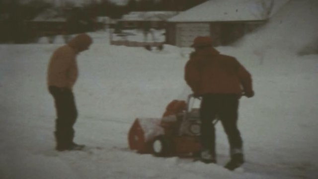 clearing snow after a blizzard with snowblower
