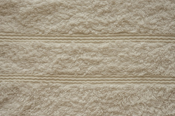 Бежевое махровое полотенце текстура. Натуральная хлопковая махровая ткань