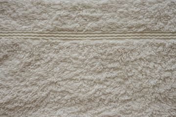 Бежевое махровое полотенце текстура. Натуральная хлопковая махровая ткань