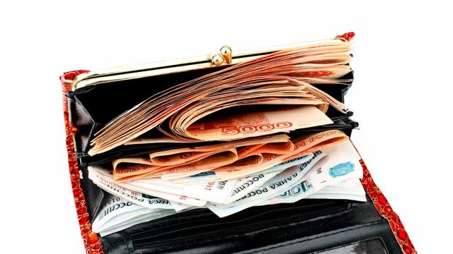 Time lapse: growing and shrinking stack of russian banknotes in red wallet as object on white background