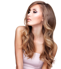 Fototapeta premium Profile of a beautiful woman with long wavy hair