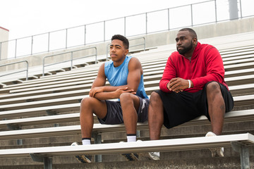 Coach spending time mentoring a student athlete.