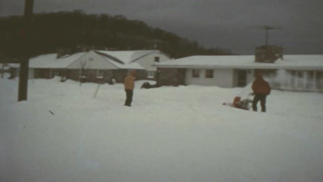 clearing snow after a blizzard with snowblower
