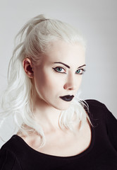 Studio portrait of beautiful blonde girl. Closeup