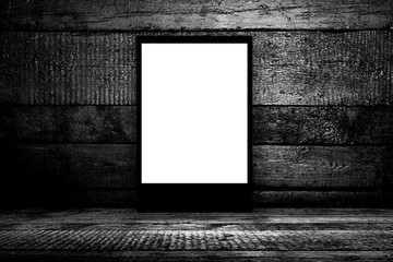 Blank billboard in empty dark room