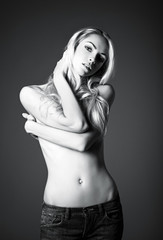 Studio fashion shot of sexy young woman. Black and white