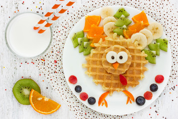 Creative idea for kids breakfast wafer with kiwi banana orange