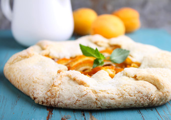 homemade cakes with apricots on a blue background, selective focus.
