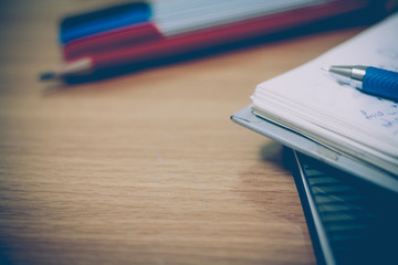 workplace with pens,pencil and notepad,diary
workplace with pens,pencil and notepad,diary on a table
